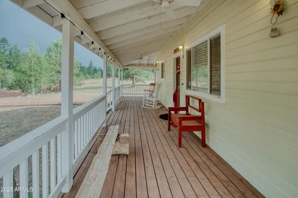a view of a balcony with wooden floor