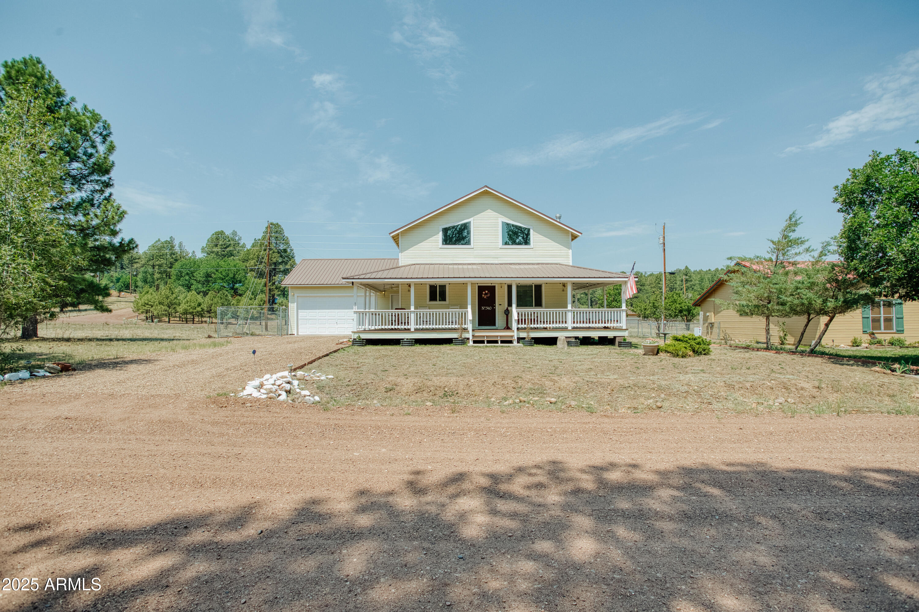 540 Rim Drive Show Low, AZ 85901 - Photo 25 of 35 a front view of a house with a yard