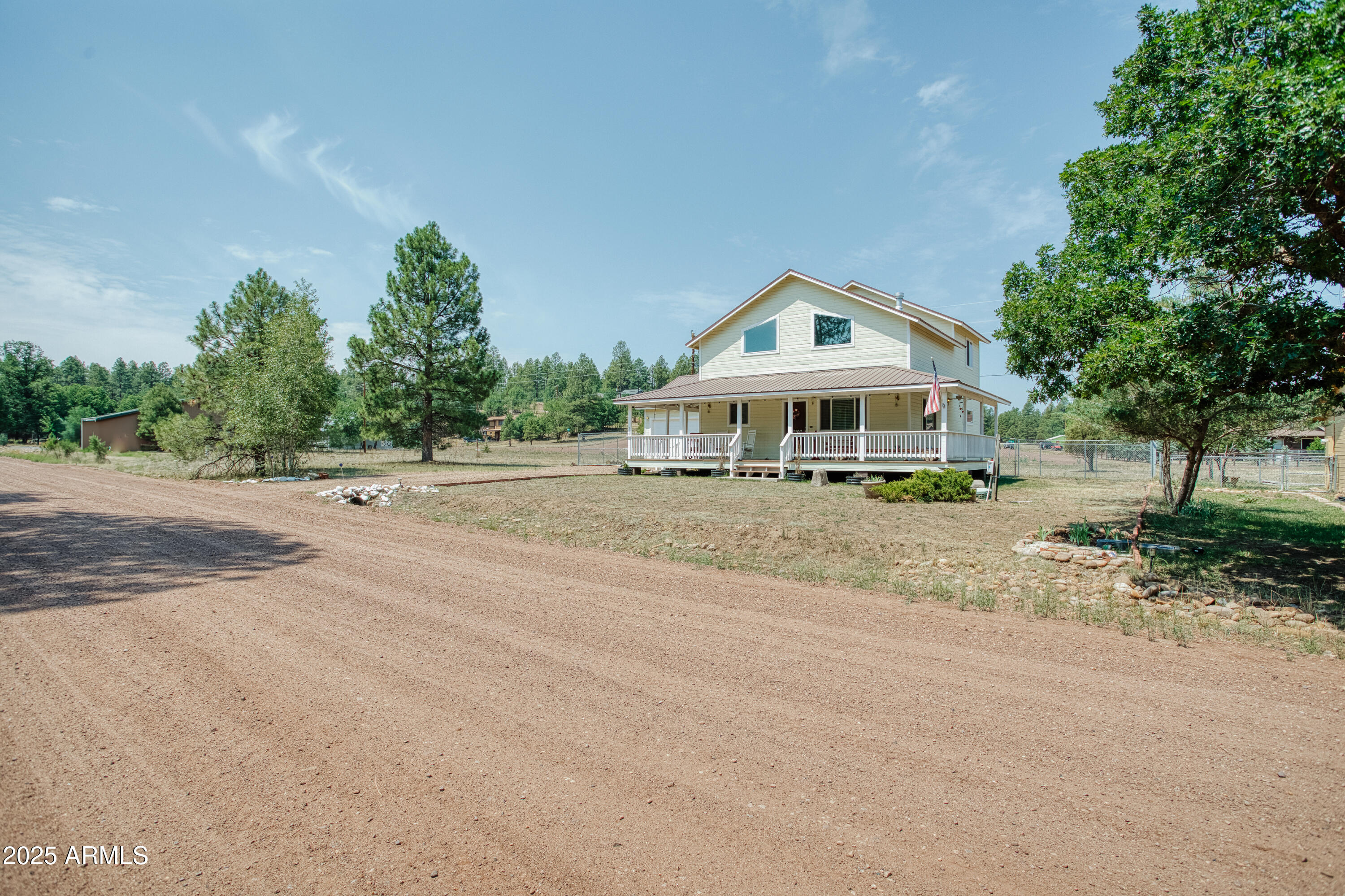 540 Rim Drive Show Low, AZ 85901 - Photo 26 of 35 a front view of a house with a yard