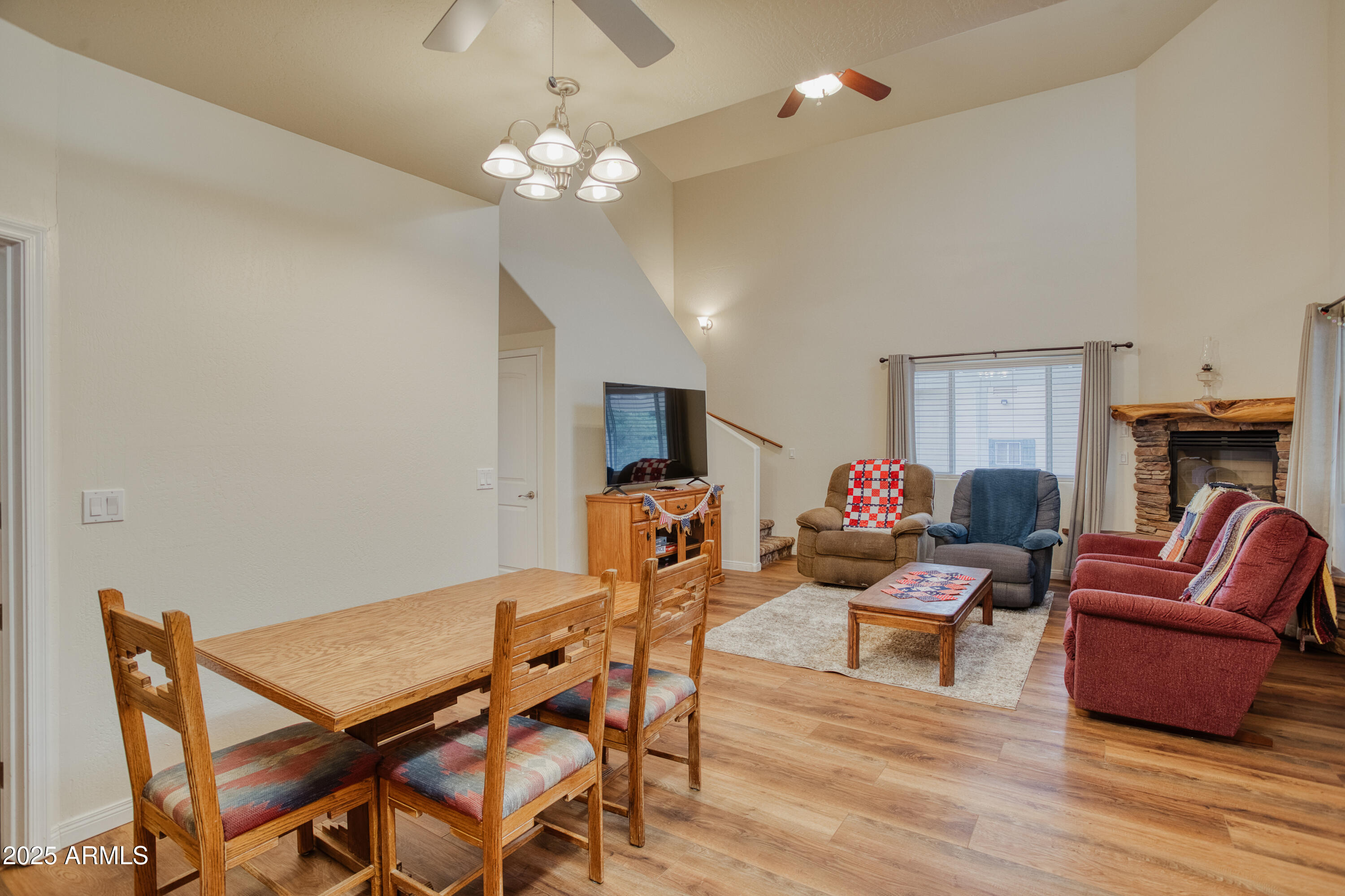540 Rim Drive Show Low, AZ 85901 - Photo 35 of 35 a living room with furniture a fireplace and a flat screen tv