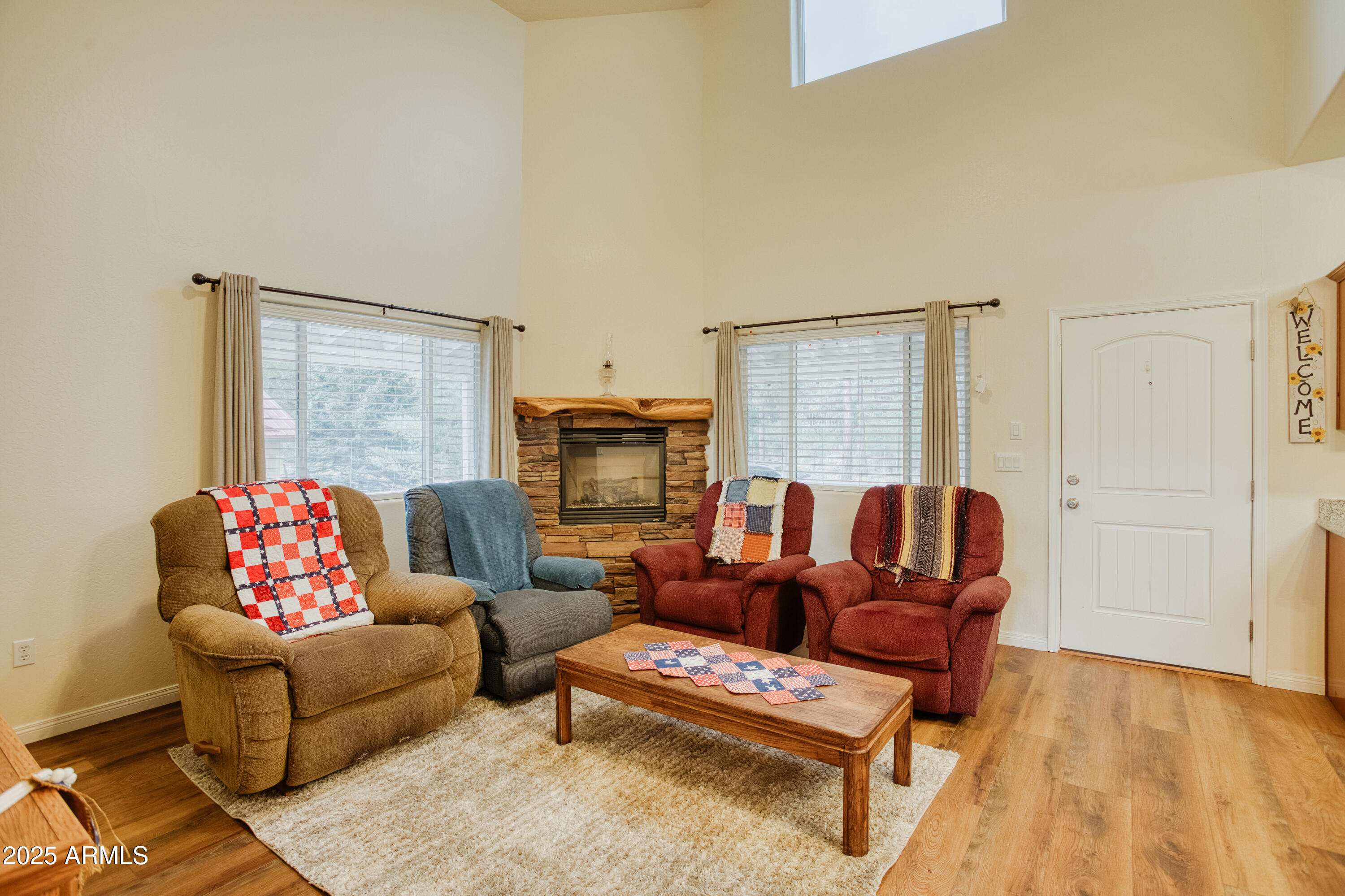 540 Rim Drive Show Low, AZ 85901 - Photo 5 of 35 a living room with furniture and a fireplace