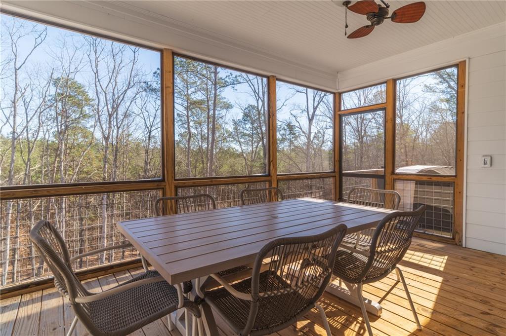 2250 Sperin Road Ball Ground, GA 30107 - Photo 19 of 56 a view of a balcony dining area with furniture window