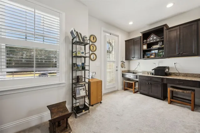 a kitchen with stainless steel appliances granite countertop a stove and a refrigerator
