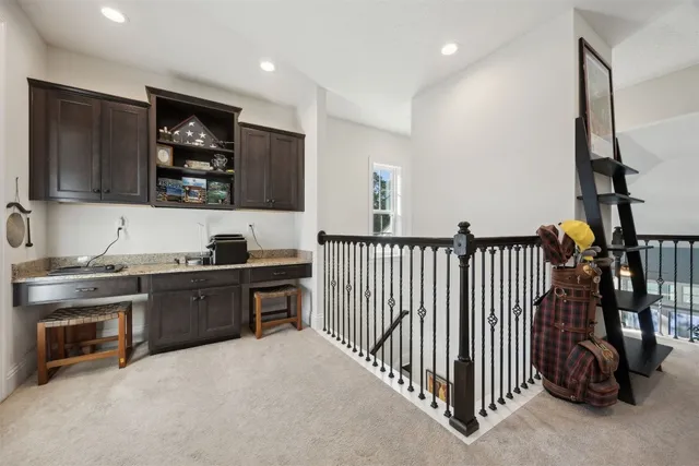 a kitchen with stainless steel appliances kitchen island granite countertop a sink and a stove top oven