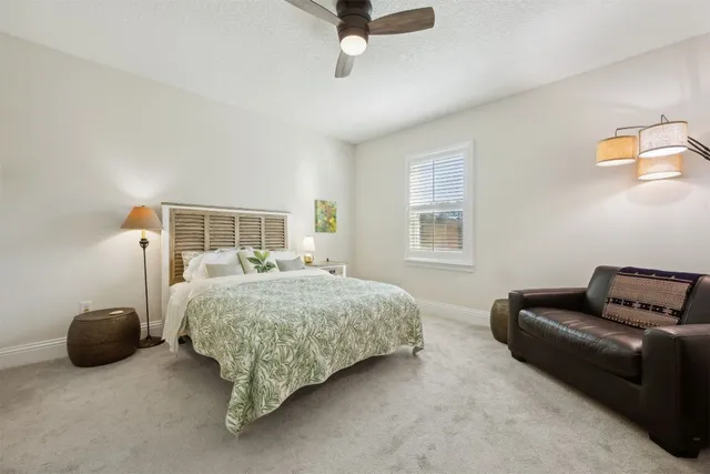 a bedroom with furniture and a window