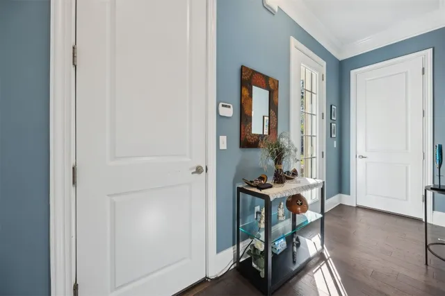 a view of living room with furniture and wooden floor