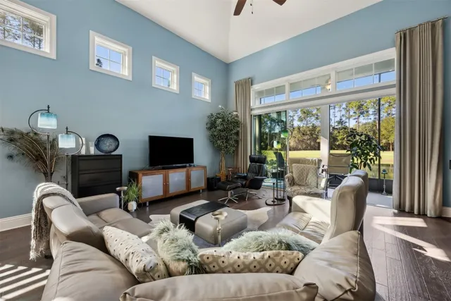 a living room with furniture window and a flat screen tv