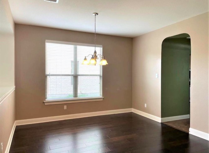 508 Tyree Road Cedar Park, TX 78613 - Photo 4 of 22 an empty room with wooden floor and windows