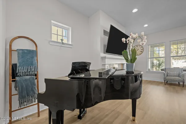 a bathroom with a toilet a sink and a mirror