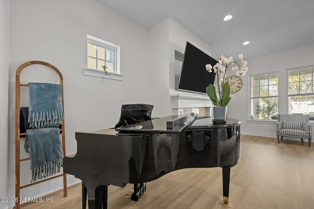 a bathroom with a toilet a sink and a mirror