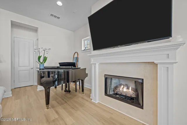 a bed room with bed and a large window