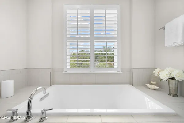 a view of wooden floor and windows in a room