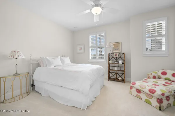 a white toilet sitting next to a shower
