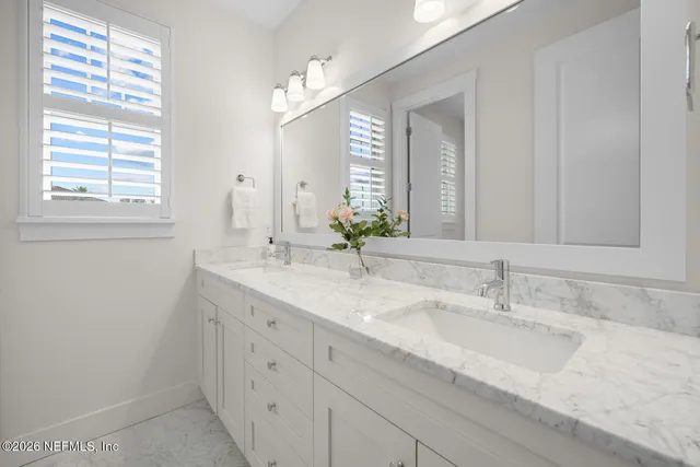 a spacious bedroom with a bed and a window