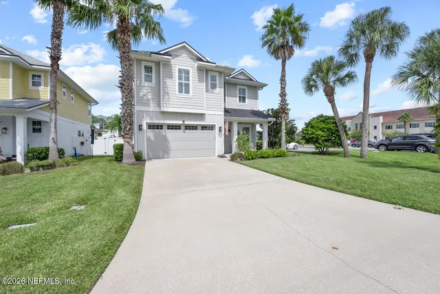 a aerial view of a house with a yard