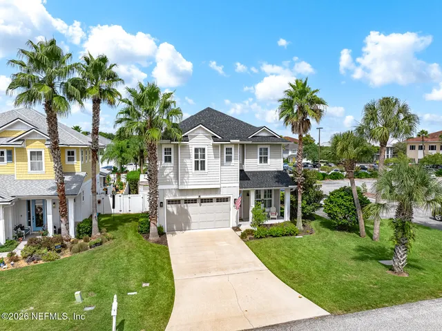 an aerial view of a house with a garden and a yard