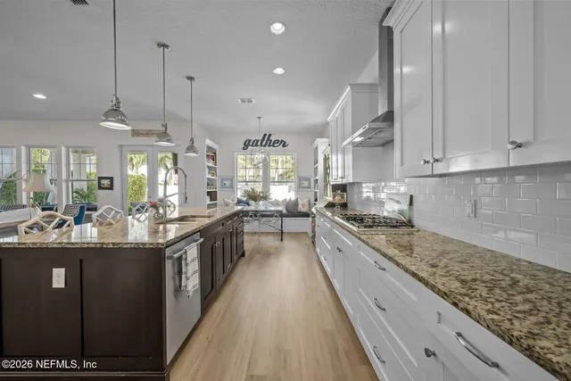 a kitchen with stainless steel appliances granite countertop a sink counter space and cabinets