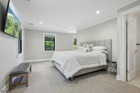 a bedroom with a bed and a chair