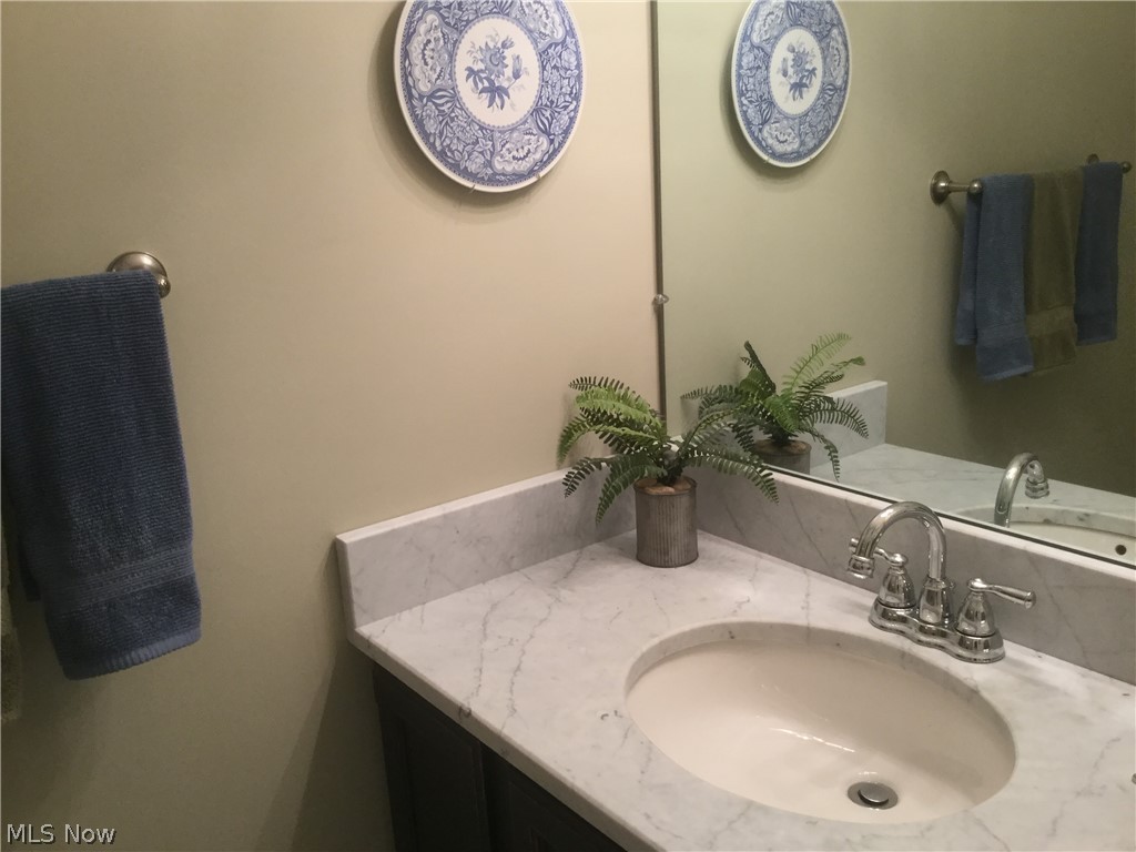 30069 Center Ridge Road, Unit D Westlake, OH 44145 - Photo 31 of 34 Updated half bath between foyer and laundry room.