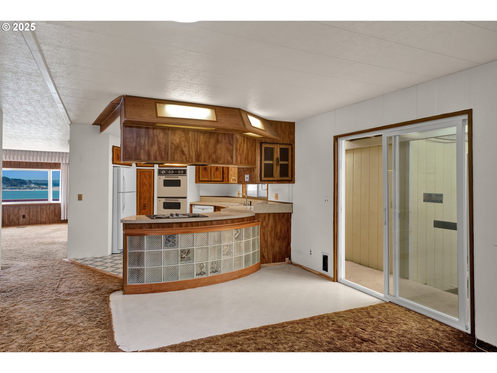1601 Rhododendron Drive, Unit 610 Florence, OR 97439 - Photo 14 of 48 a view interior of kitchen and natural light
