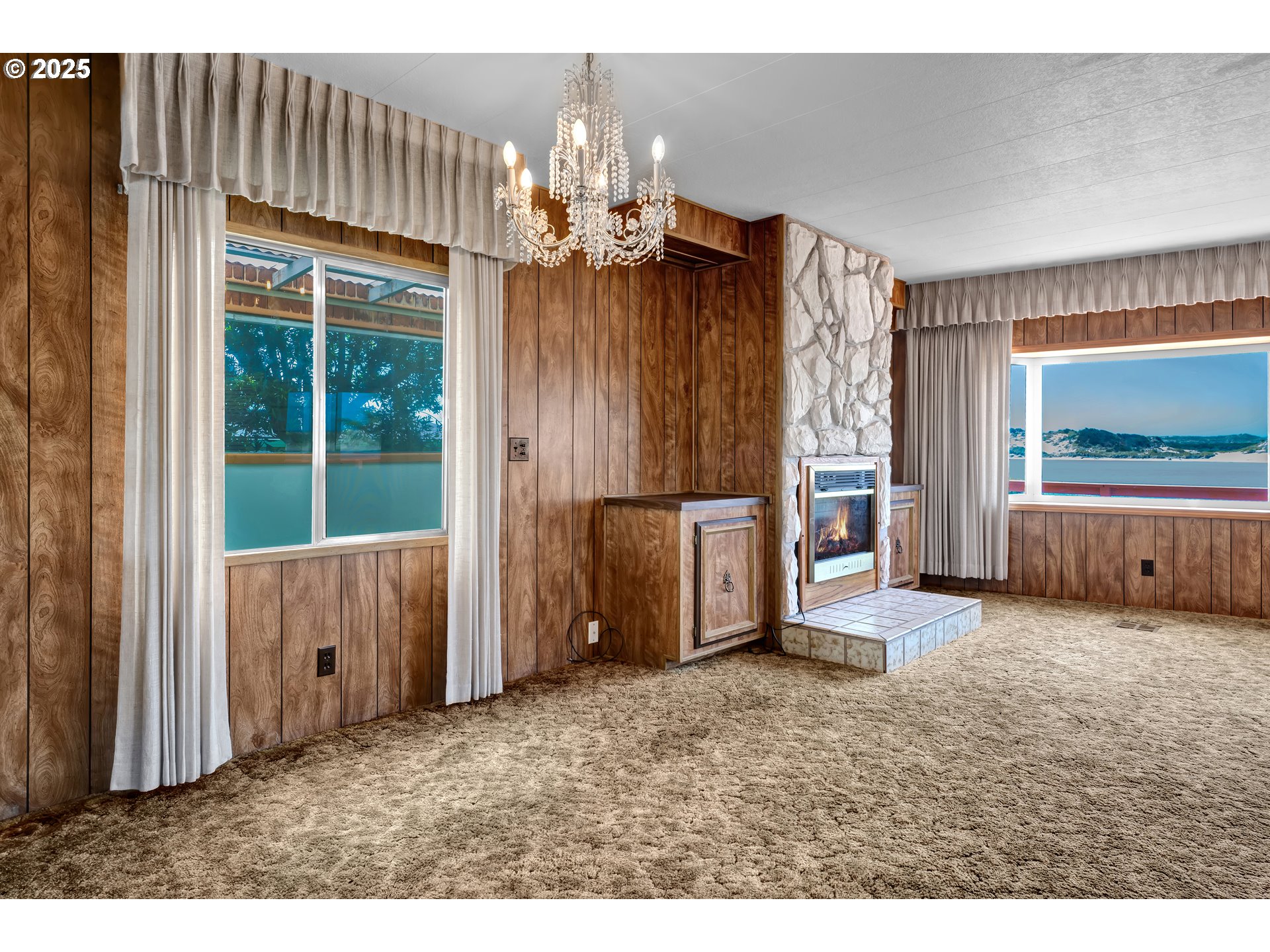 1601 Rhododendron Drive, Unit 610 Florence, OR 97439 - Photo 21 of 48 a view of a livingroom with furniture and chandelier