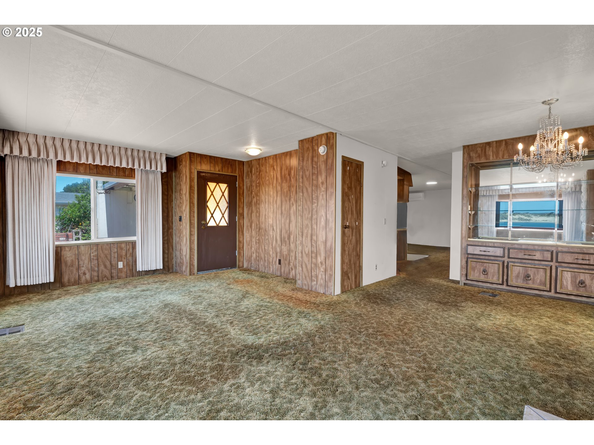 1601 Rhododendron Drive, Unit 610 Florence, OR 97439 - Photo 24 of 48 a view of an empty room and window