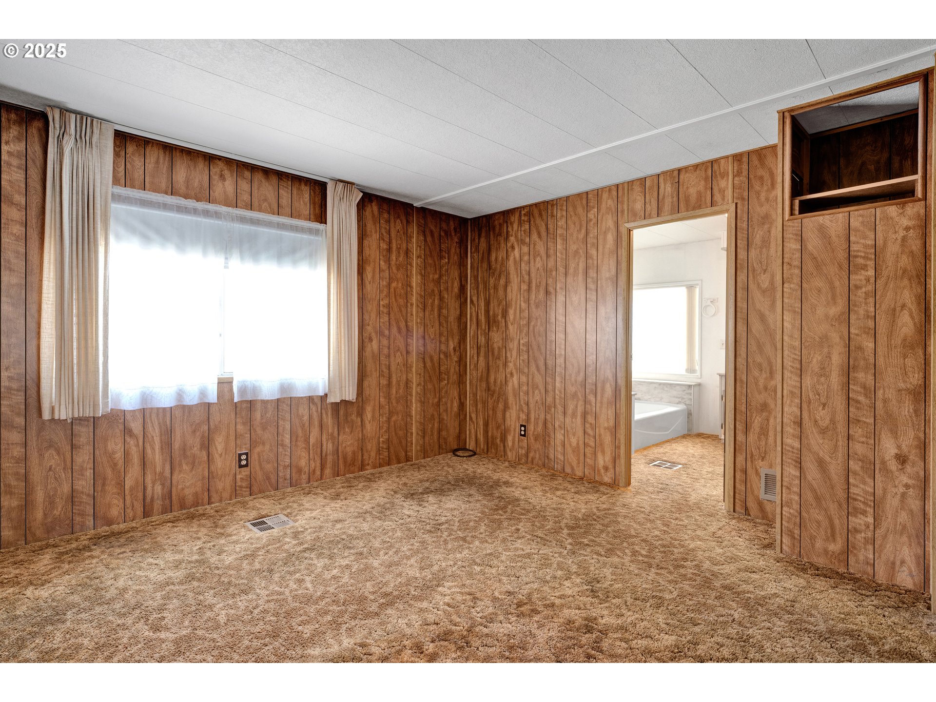 1601 Rhododendron Drive, Unit 610 Florence, OR 97439 - Photo 28 of 48 a view of an empty room with a window