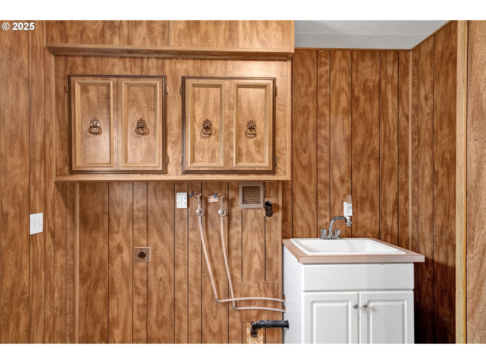 1601 Rhododendron Drive, Unit 610 Florence, OR 97439 - Photo 35 of 48 a bathroom with a sink a mirror and a shower curtain