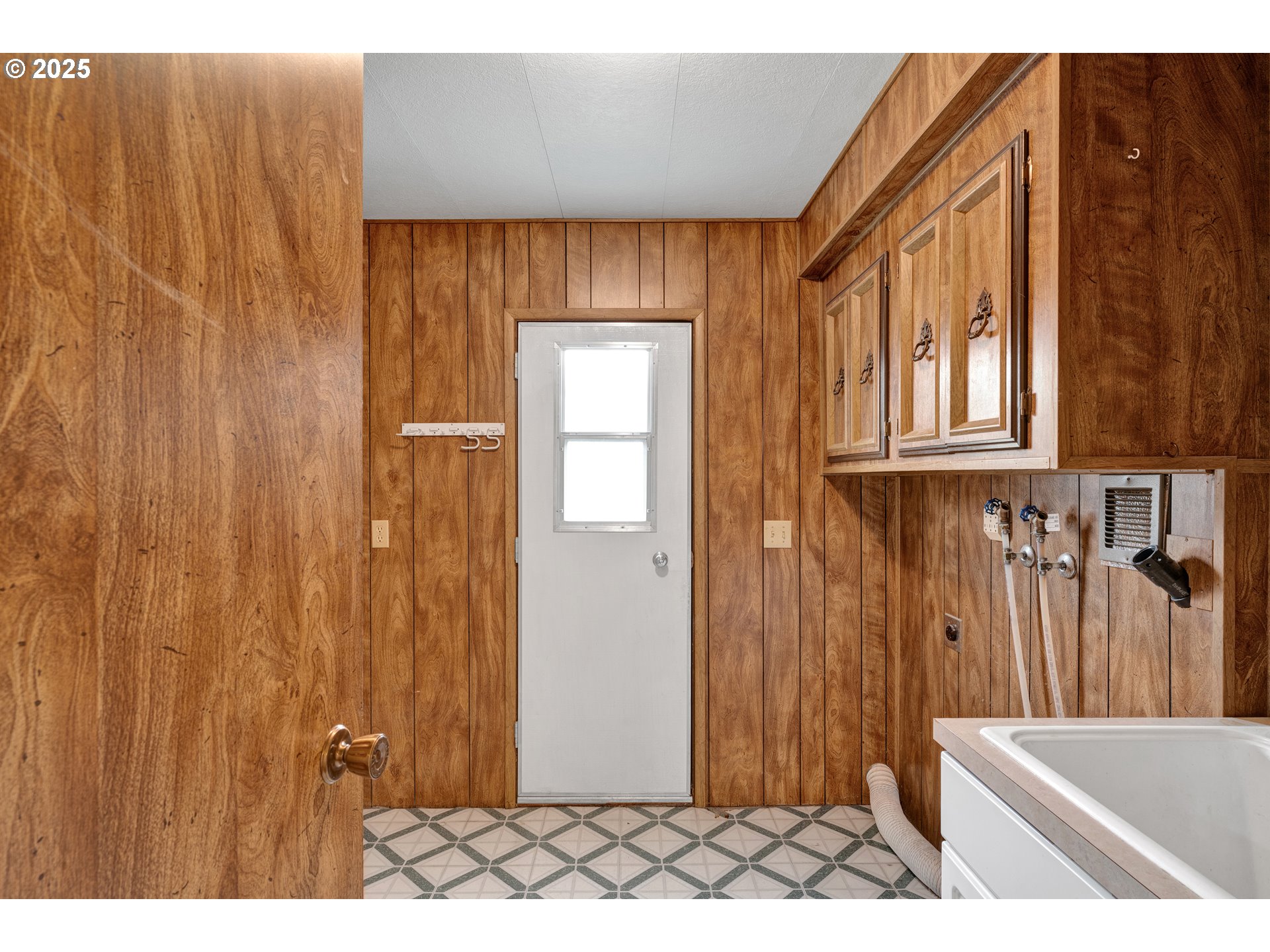 1601 Rhododendron Drive, Unit 610 Florence, OR 97439 - Photo 36 of 48 a view of a door and wooden floor