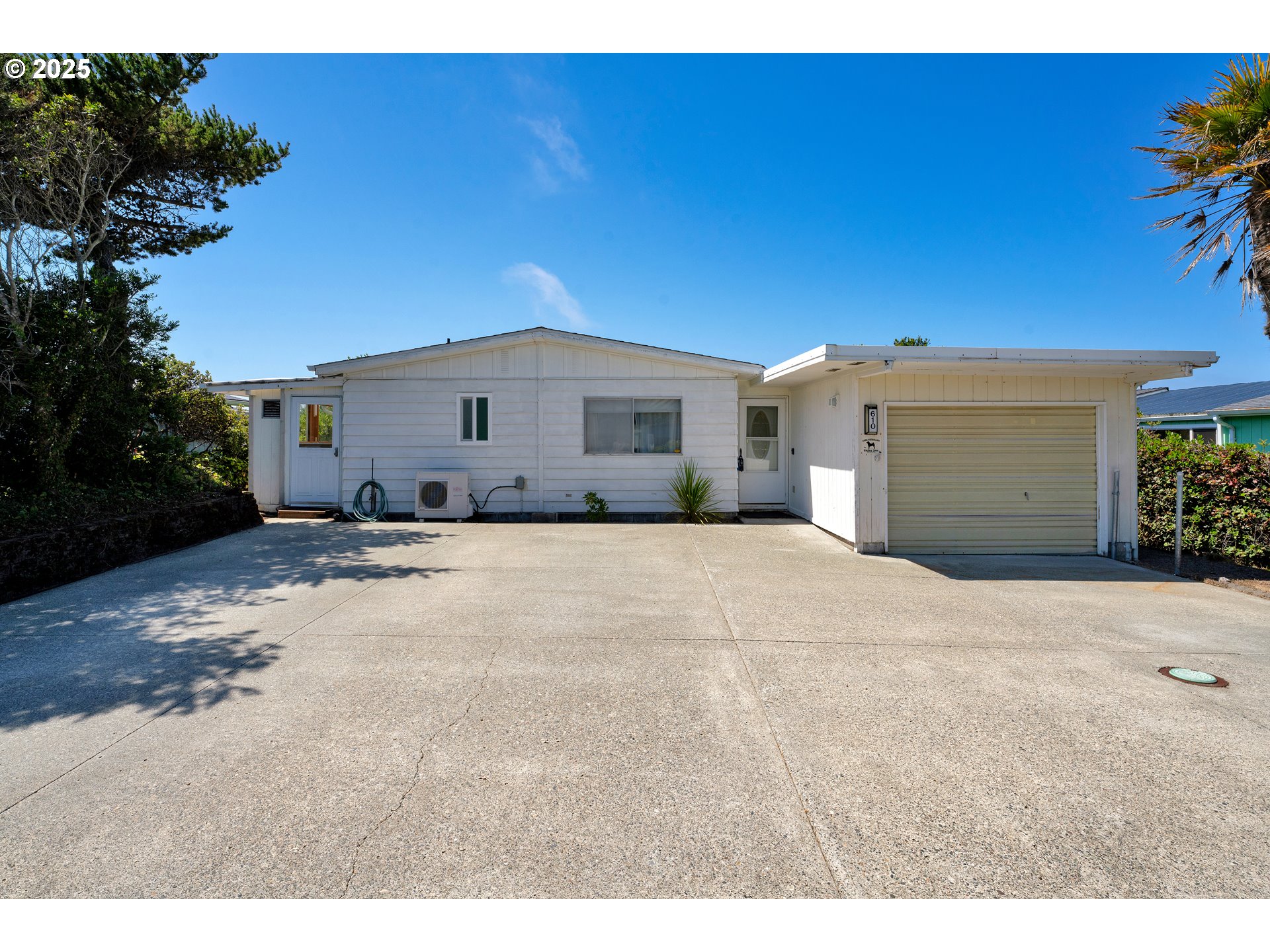 1601 Rhododendron Drive, Unit 610 Florence, OR 97439 - Photo 46 of 48 a view of garage and yard