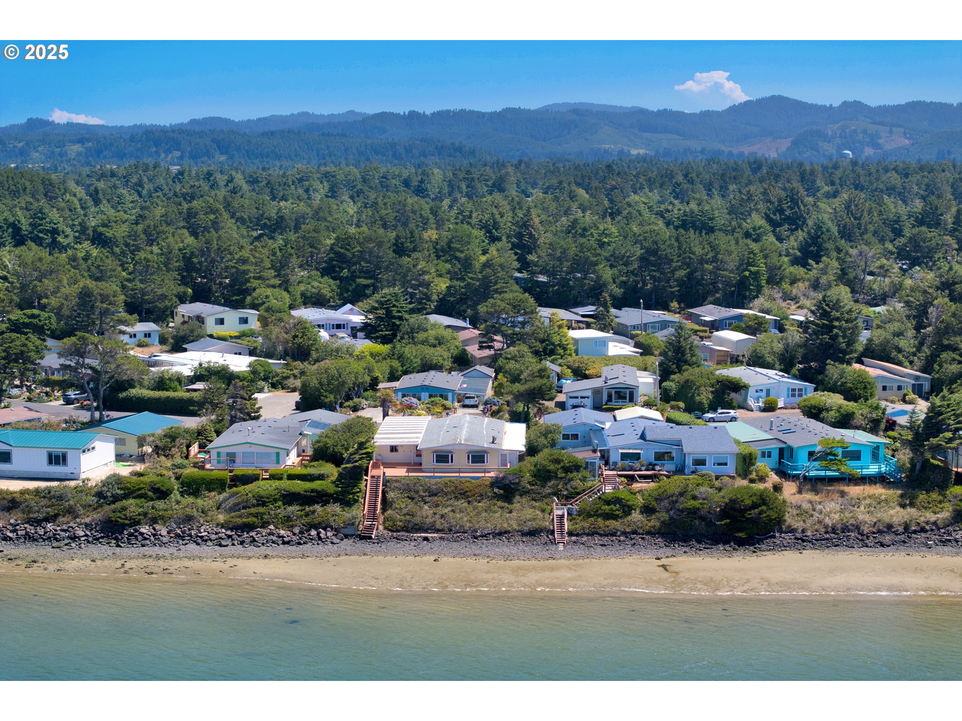 1601 Rhododendron Drive, Unit 610 Florence, OR 97439 - Photo 5 of 48 a view of a town with mountains in the background