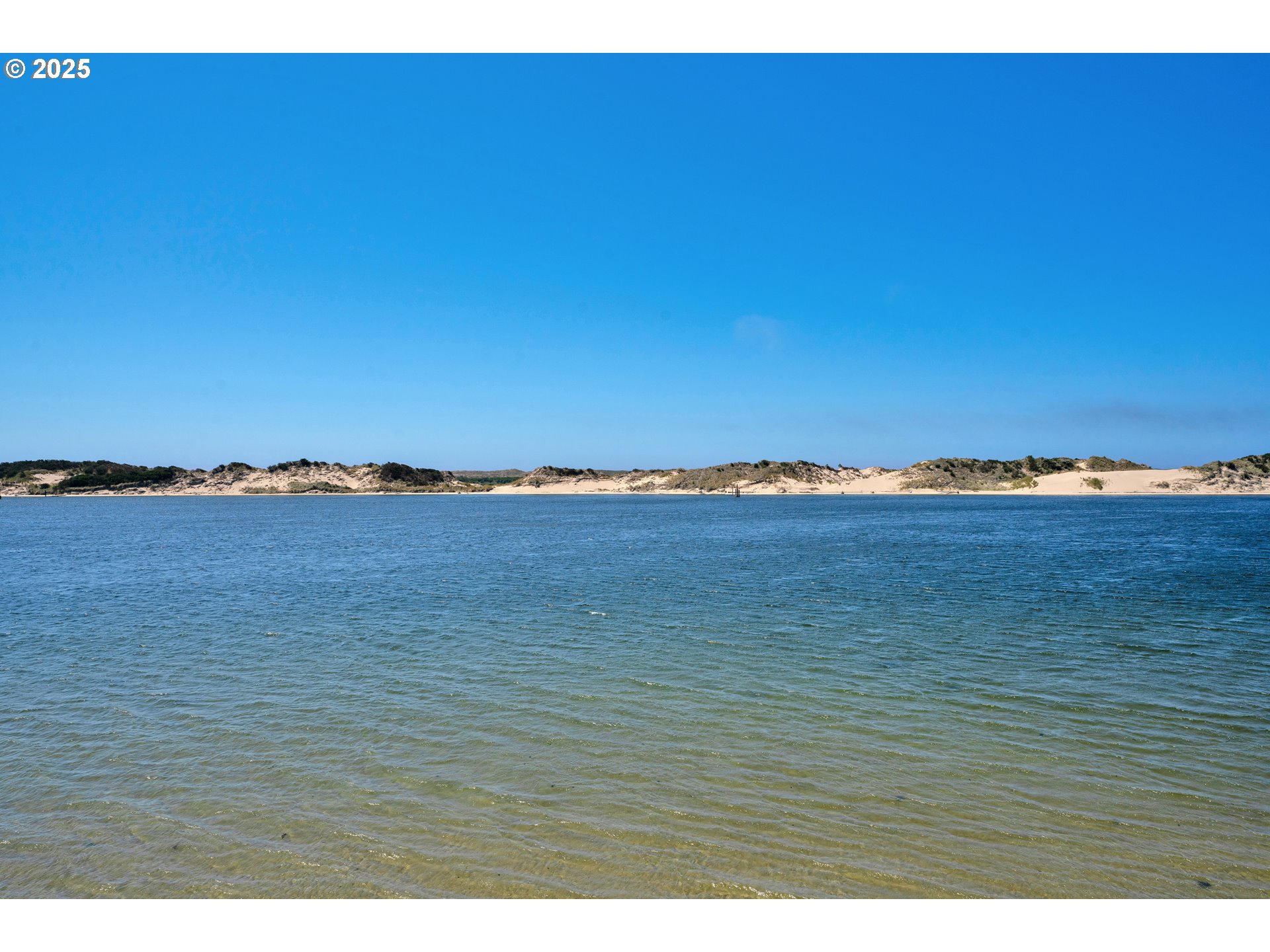 1601 Rhododendron Drive, Unit 610 Florence, OR 97439 - Photo 7 of 48 a view of an ocean and beach