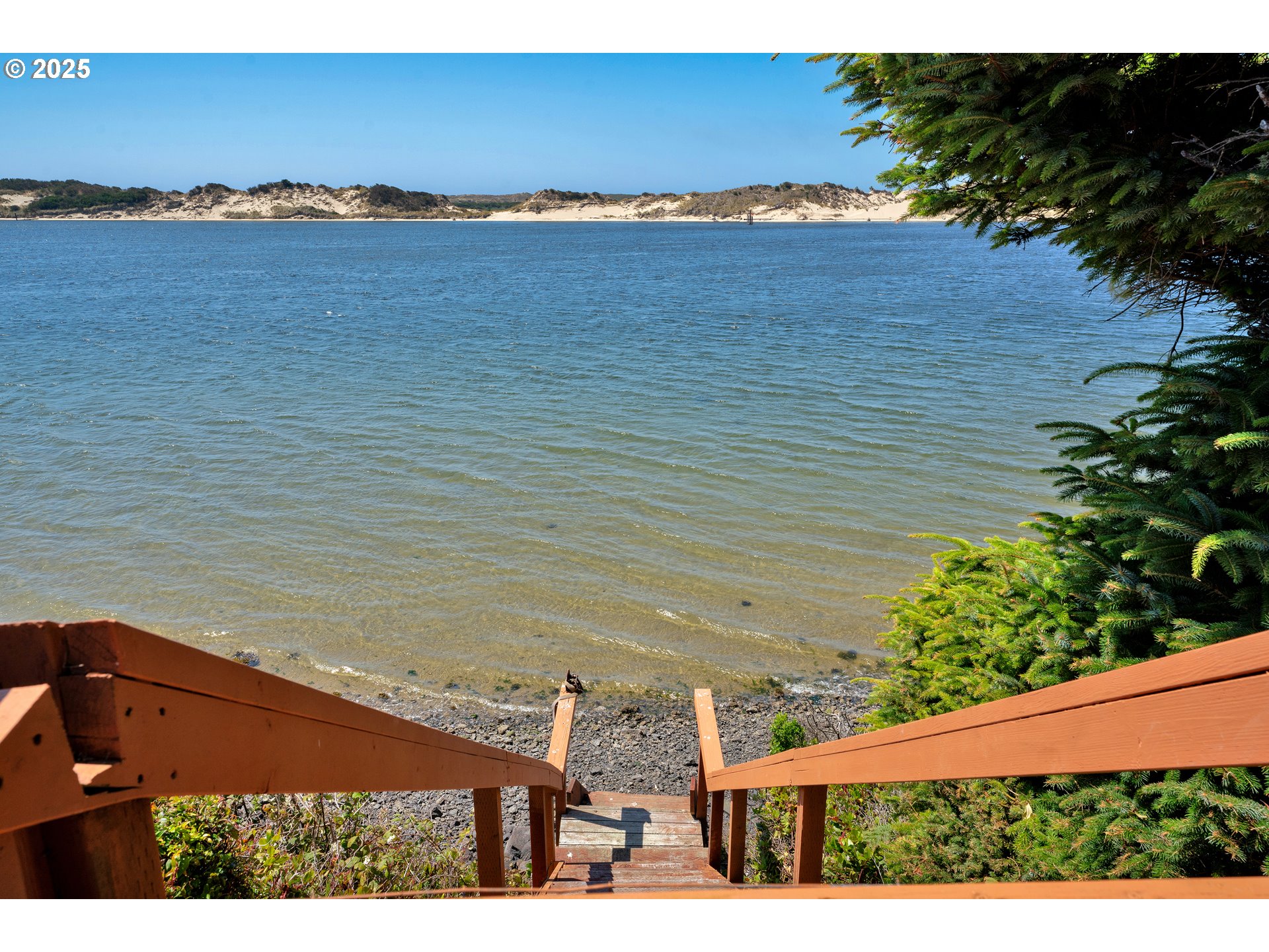 1601 Rhododendron Drive, Unit 610 Florence, OR 97439 - Photo 8 of 48 a view of an ocean and beach
