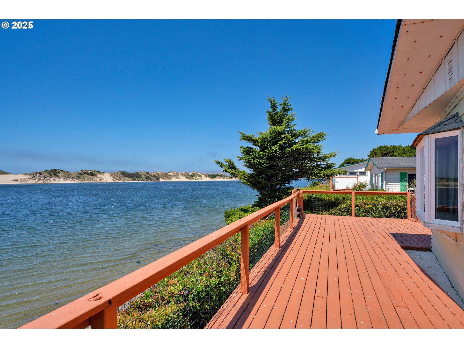 1601 Rhododendron Drive, Unit 610 Florence, OR 97439 - Photo 9 of 48 a view of balcony with wooden floor and outdoor space