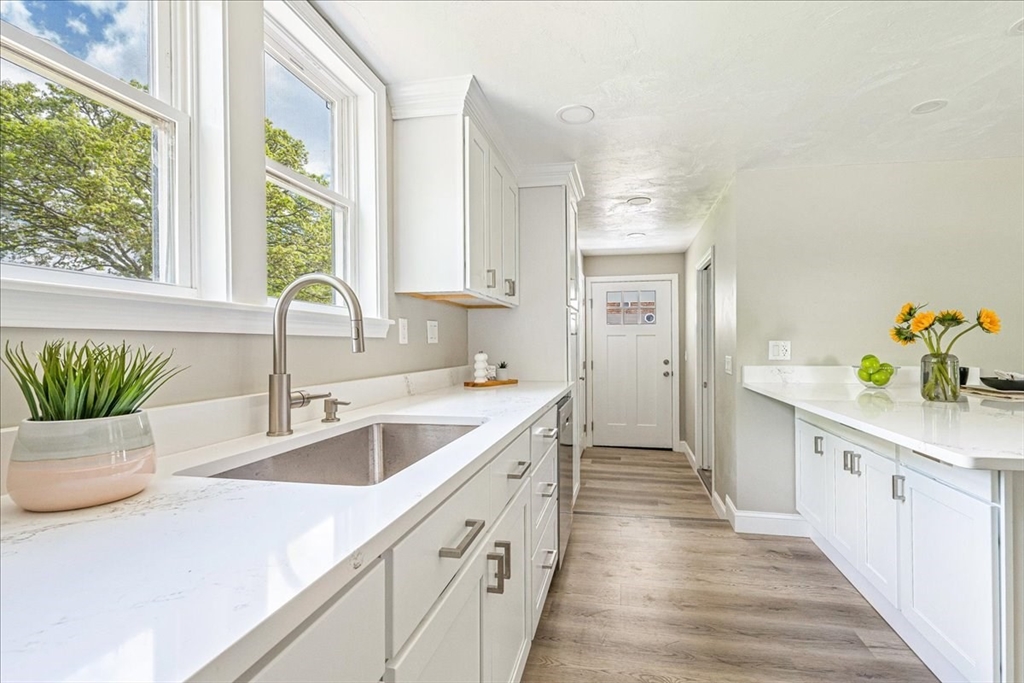 1009 Point Road Marion, MA 02738 - Photo 13 of 31 a kitchen with a sink a counter top space and living room