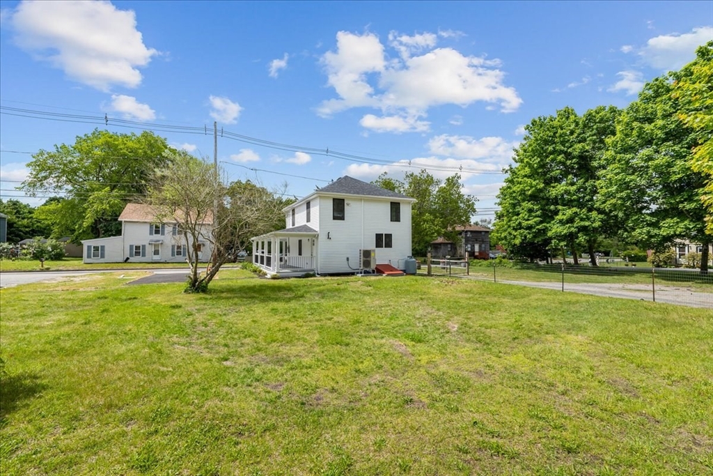 1009 Point Road Marion, MA 02738 - Photo 26 of 31 a view of a house with a backyard