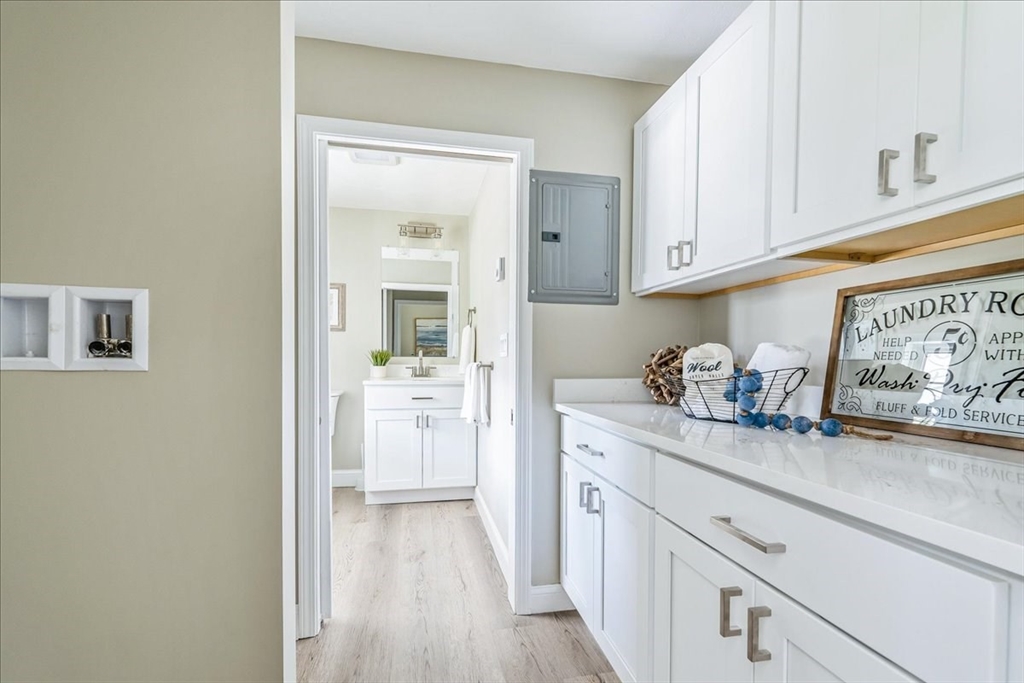 1009 Point Road Marion, MA 02738 - Photo 10 of 31 a kitchen with stainless steel appliances granite countertop a refrigerator and cabinets