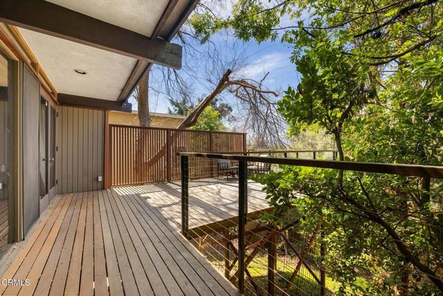a spacious bedroom with a bed and a large window