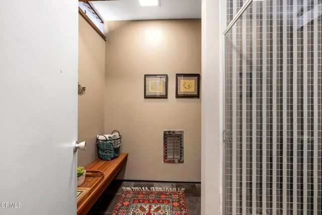 a view of a chairs and table in patio