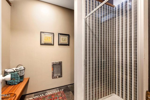 a view of a patio with a dining table and chairs