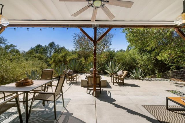 an aerial view of a house with a yard and garden