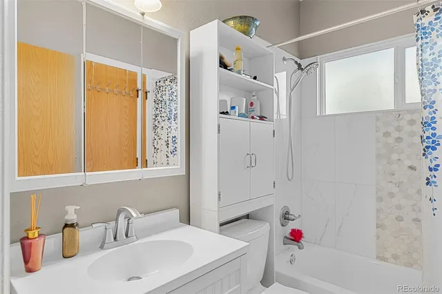 a bathroom with a sink and a shower