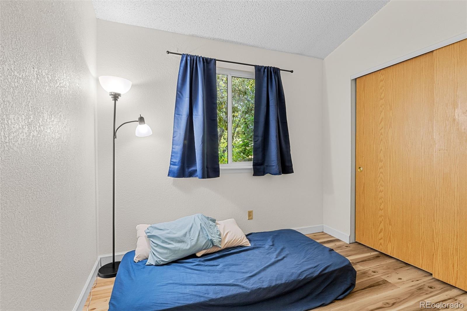 5323 East Sandpiper Avenue Castle Rock, CO 80104 - Photo 22 of 46 a room with window and wooden floor