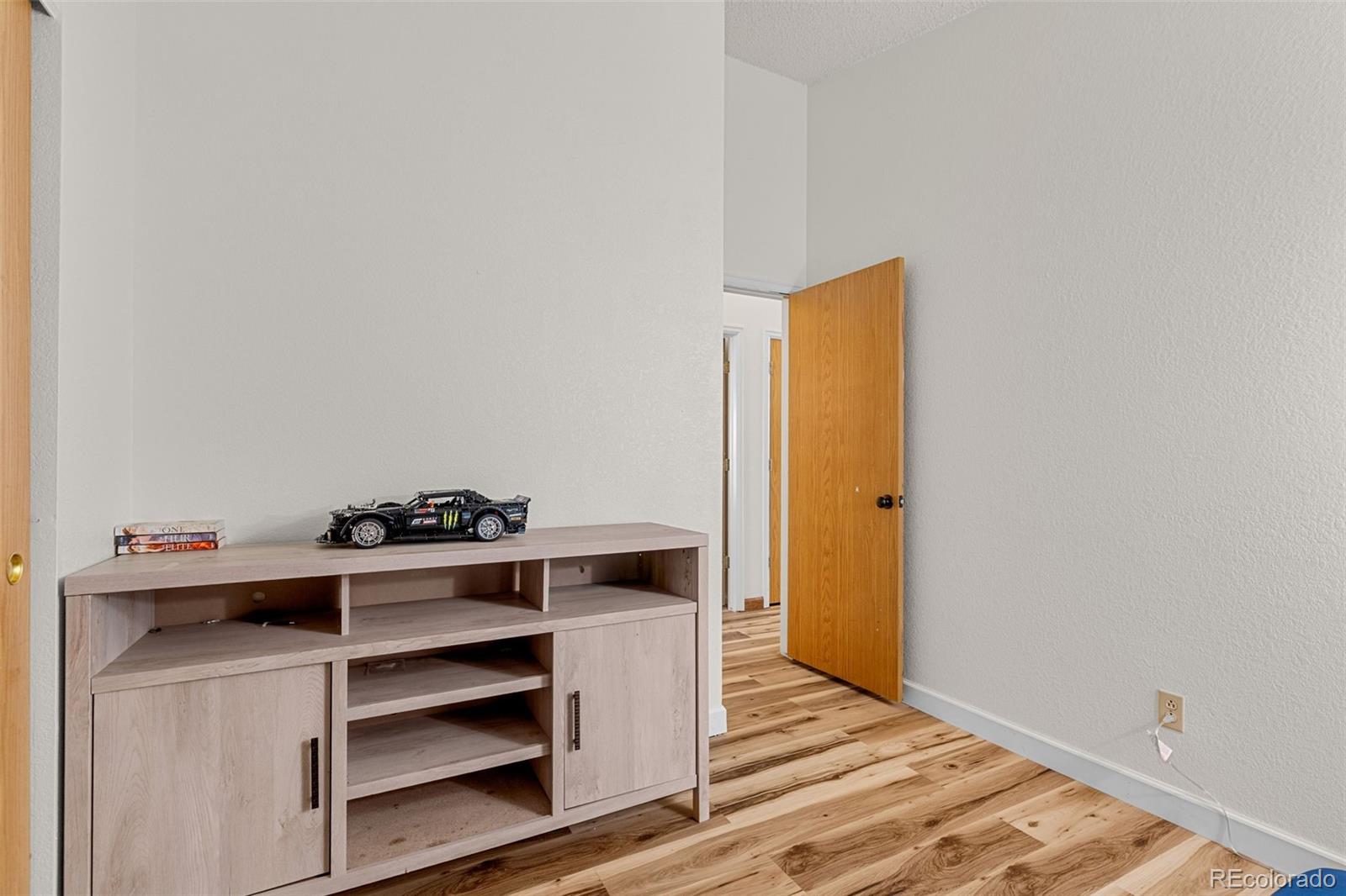 5323 East Sandpiper Avenue Castle Rock, CO 80104 - Photo 23 of 46 a view of storage and utility room with wooden floor