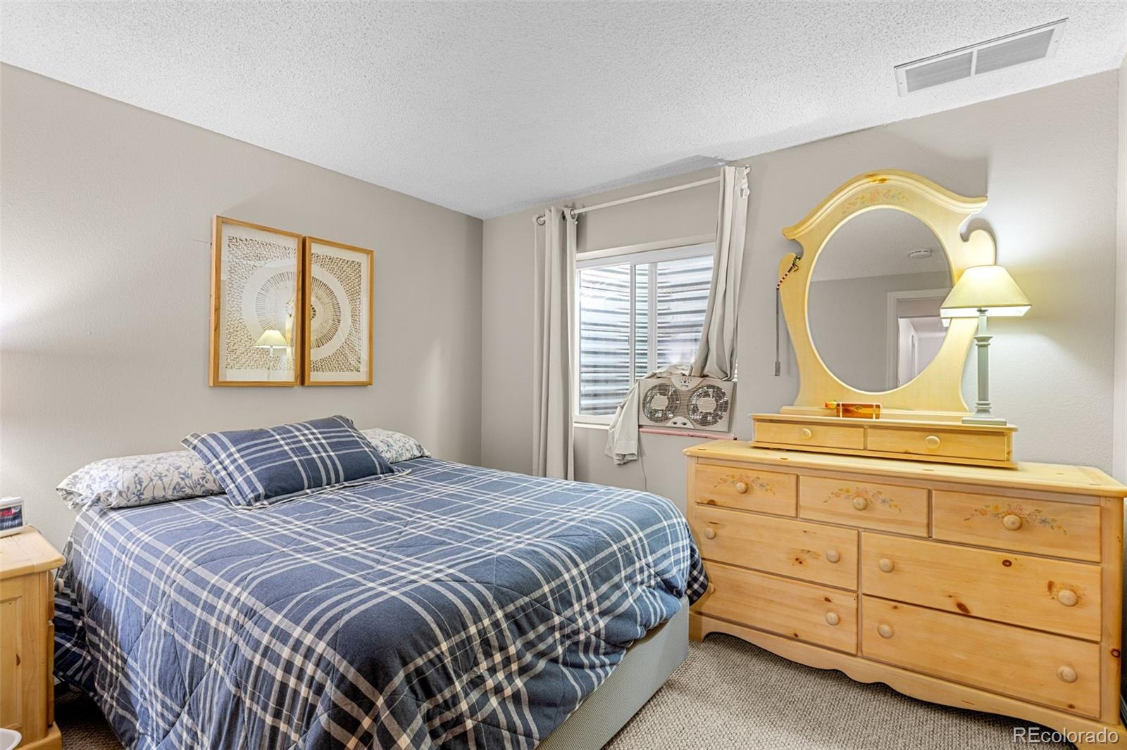 5323 East Sandpiper Avenue Castle Rock, CO 80104 - Photo 24 of 46 a bedroom with a bed and a dresser