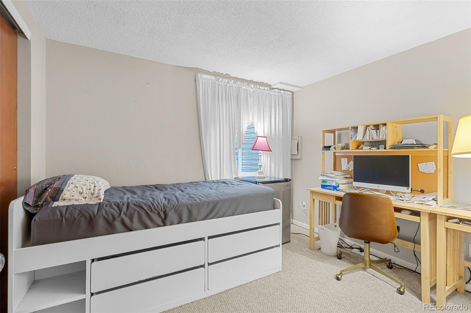 5323 East Sandpiper Avenue Castle Rock, CO 80104 - Photo 29 of 46 a bedroom with a workspace