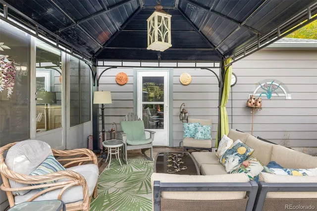 a outdoor living space with patio furniture and a potted plant