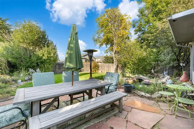 a view of a chairs and table in the patio