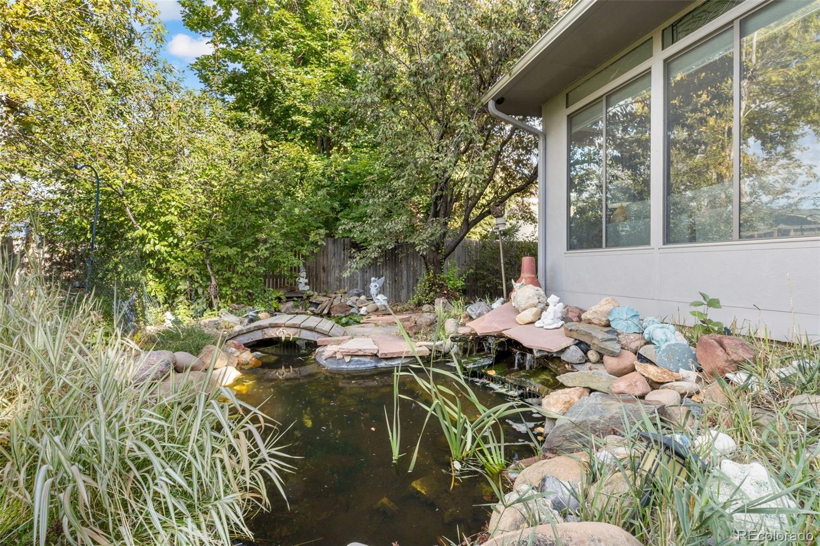 5323 East Sandpiper Avenue Castle Rock, CO 80104 - Photo 42 of 46 a backyard of a house with table and chairs