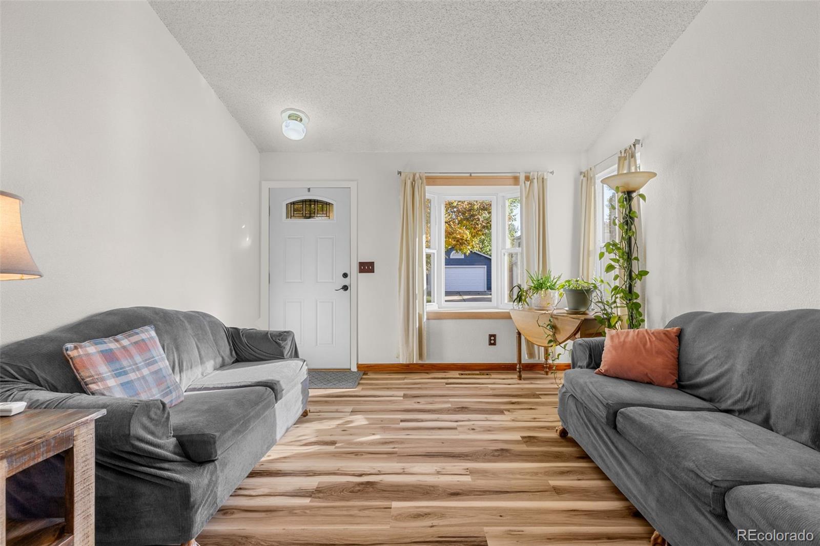 5323 East Sandpiper Avenue Castle Rock, CO 80104 - Photo 7 of 46 a living room with furniture and a couch